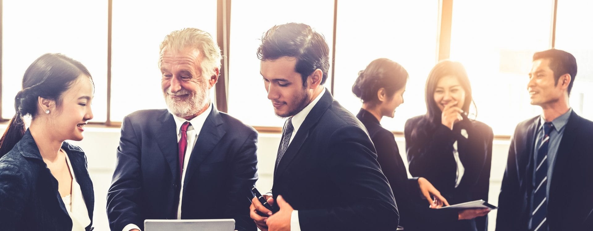 Many business people gathering in large group meeting or business conference. Businessman and businesswoman working in the modern office.