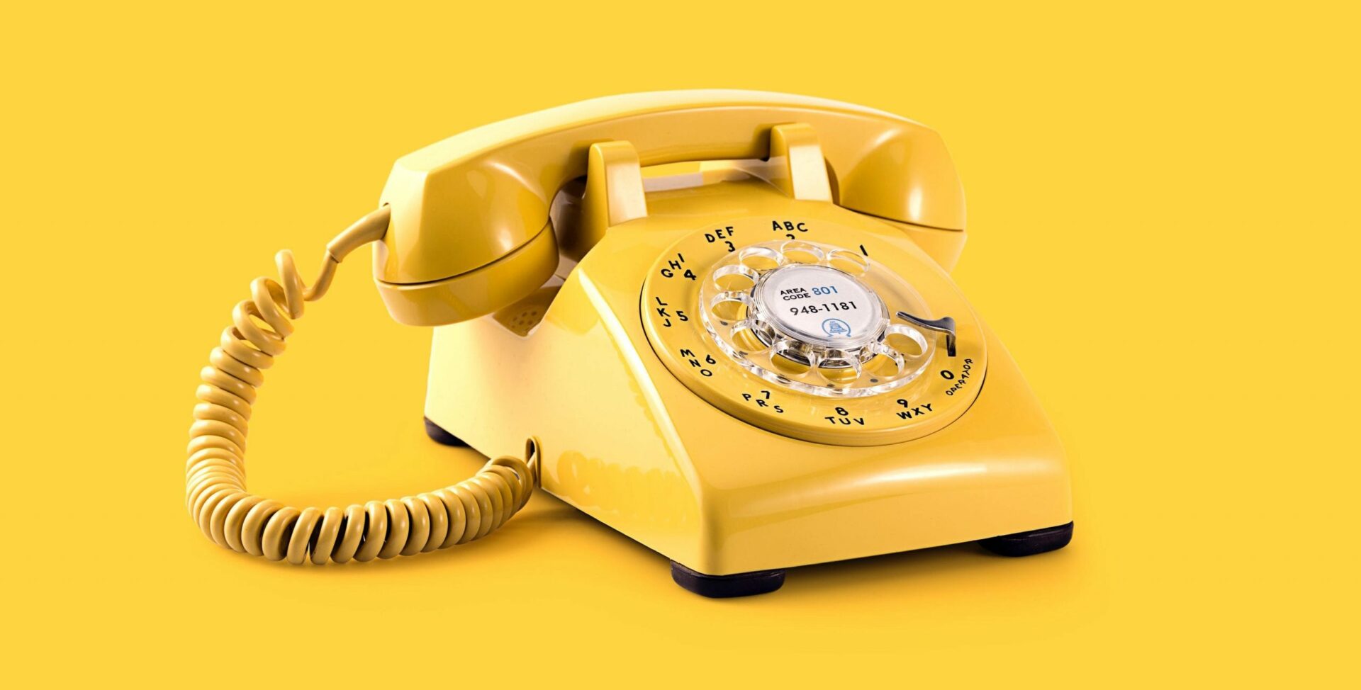 yellow phone on yellow background - sales call tips header