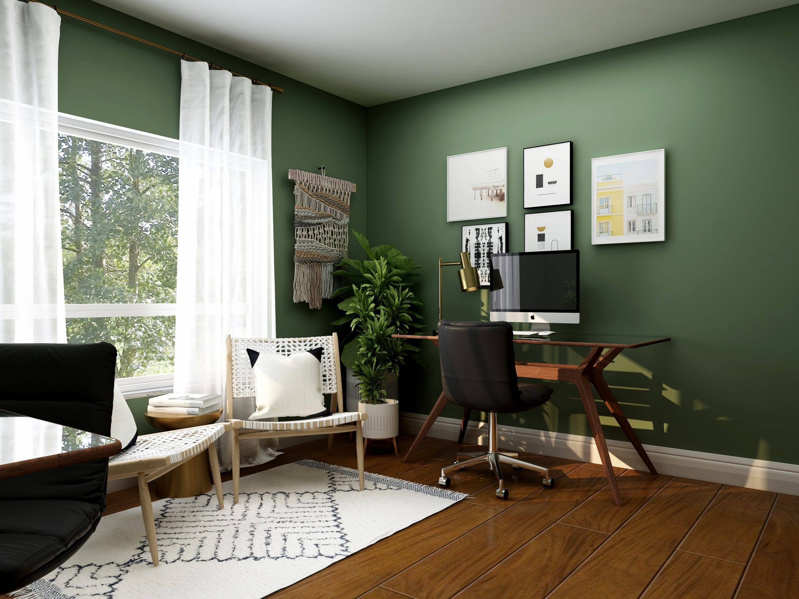 a green home office with apple computer on a desk